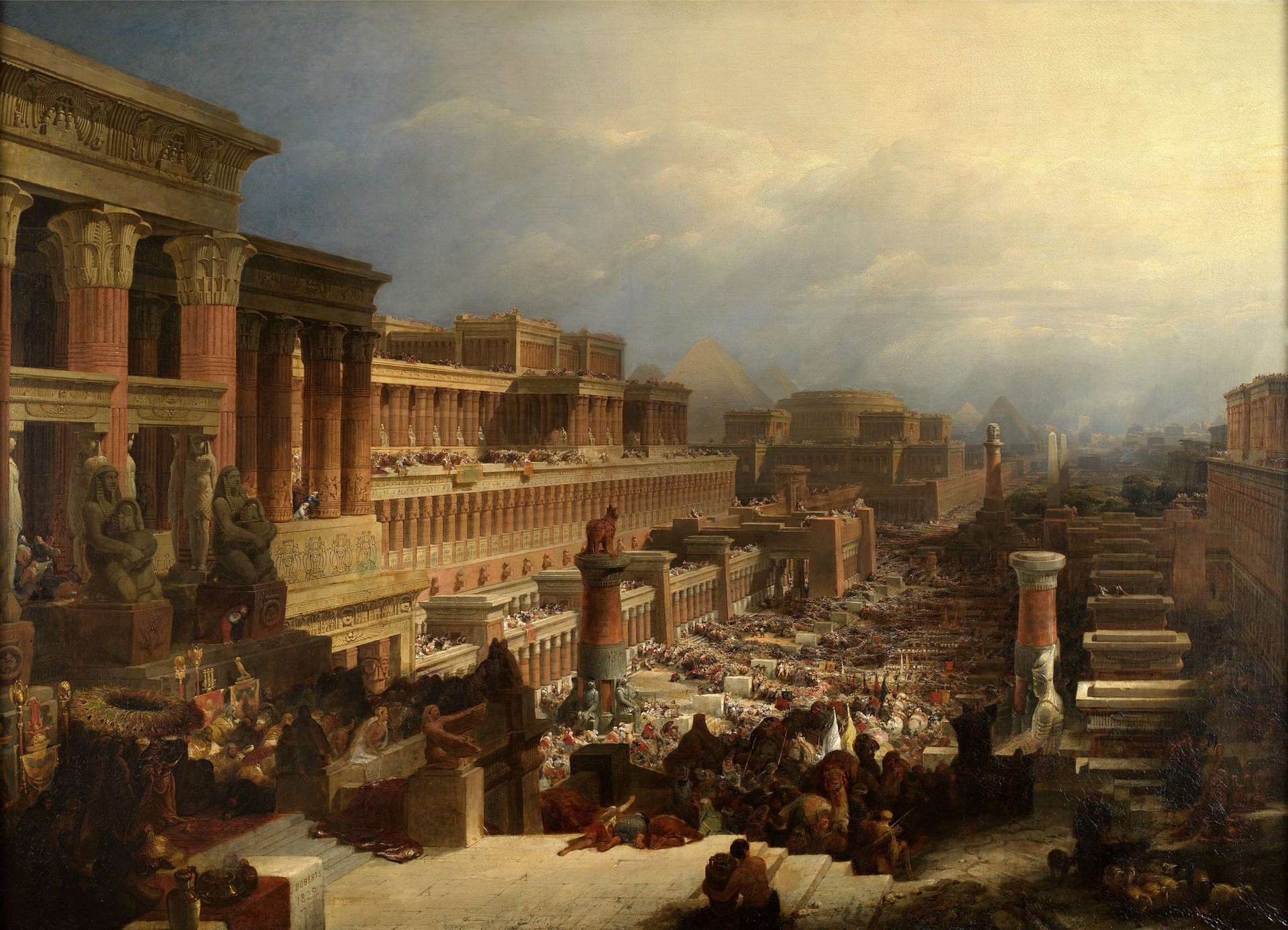 A great crowd with camels and banners streams down a long avenue between colonnaded temples, with pyramids under a hazy sky beyond.